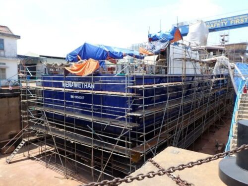 Photo of ISSG's new freight vessel under construction in Vietnam - Menawethan - showing aft of vessel with scaffolding put up for painting