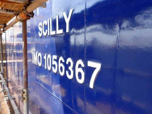 Photo of ISSG's new freight vessel under construction in Vietnam - Menawethan - text painted onto the vessel's hull