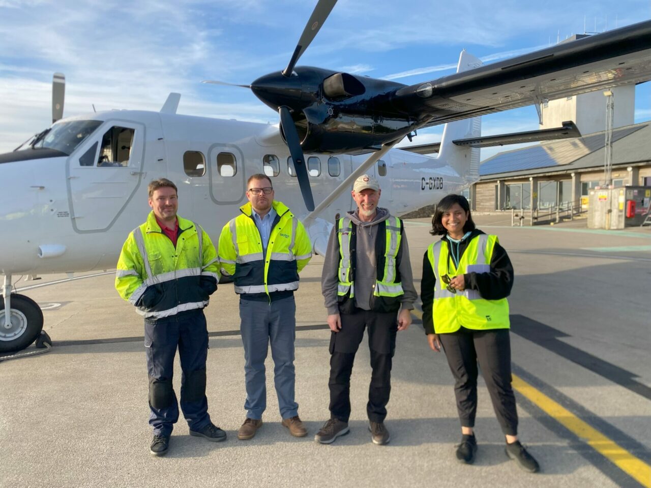 Team standing in front of the new aircraft
