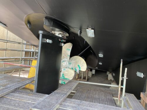 Photo of ISSG's new freight vessel under construction in Vietnam - Menawethan - showing, rudder, prop and recently painted hull