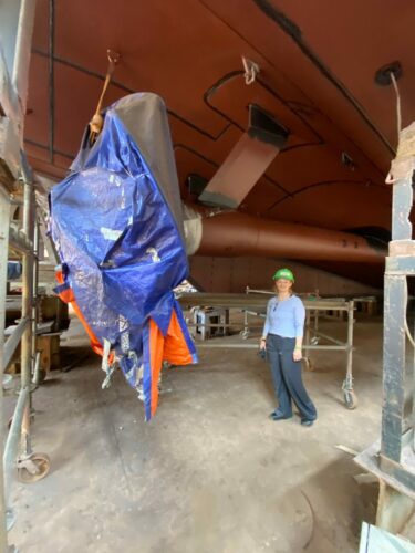 Emma stood besides the ship in Vietnam