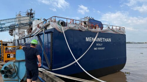 Stern of Menawethan in the water at the shipyard in Vietnam