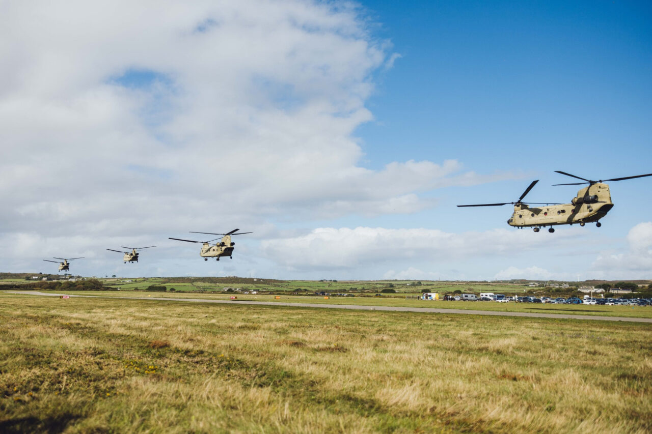 Four US army chinook helicopters landing at Land's End Airport